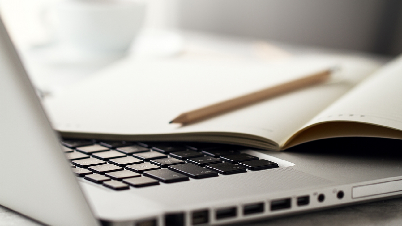 Clever student making notes at lesson