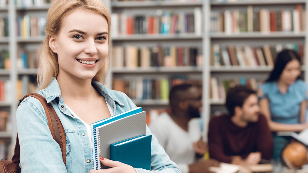 Clever student making notes at lesson
