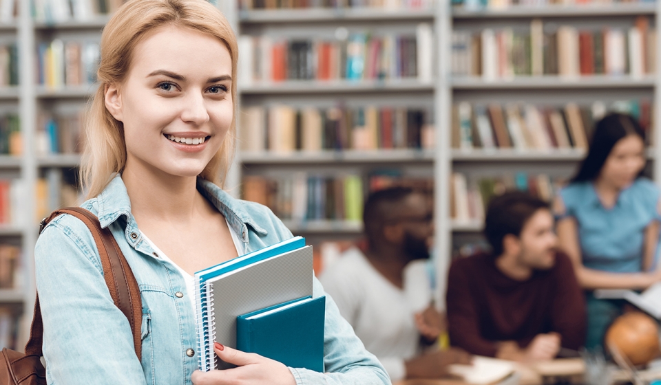 Clever student making notes at lesson